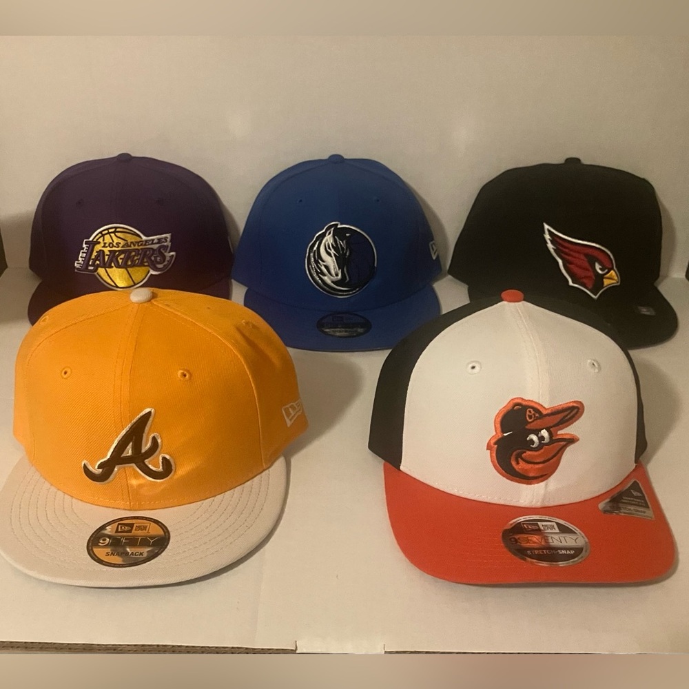 - Lakers,Mavericks,Cardinals, Braves,Orioles New Era snap back caps.  $22 each